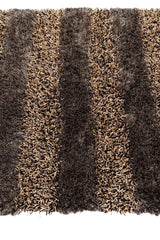 Handwoven shag rug with alternating thick stripes of dark brown and beige multi-tone fibers creating a textured, soft surface in a rectangular shape.