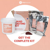 Hand Casting Kit components including a white container, two silver pouches labeled Step 1 Mold Making and Step 2 Casting Material, a red mixing stick, and branded cardboard box on pink background.