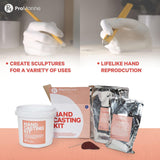 Two white plaster hand casts holding sculpting tools above a ProMarine hand casting kit with packaging and materials arranged below.
