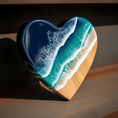 Handcrafted ocean resin heart wall art with blue resin waves on pine wood