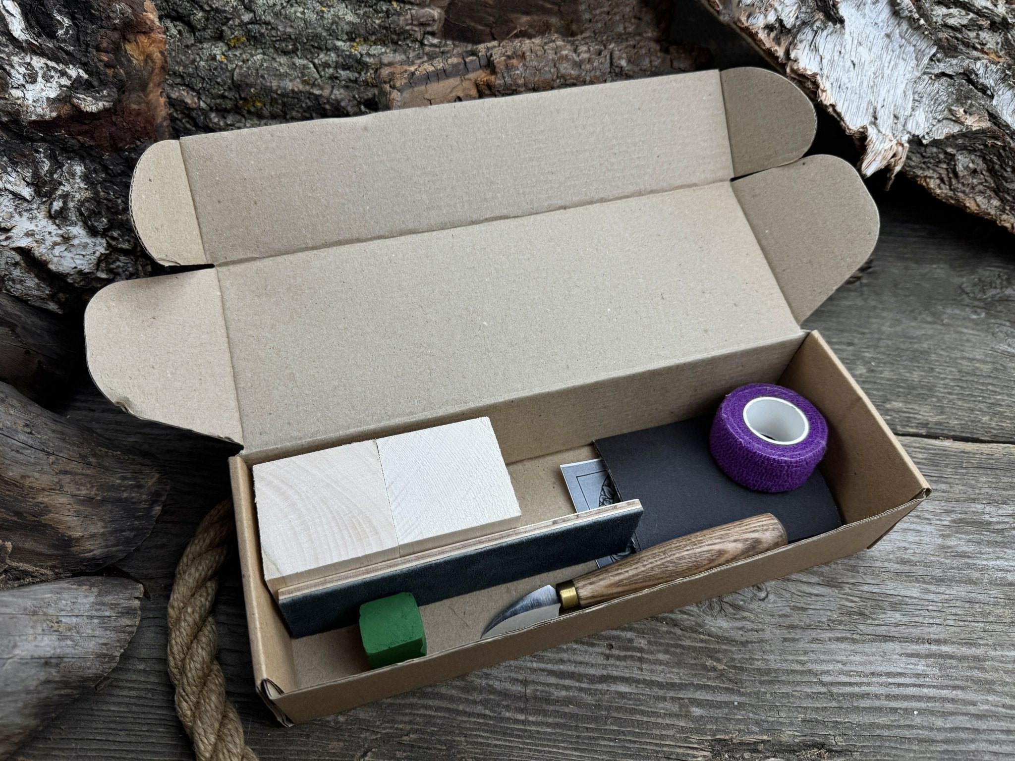 Hedgehog Wood Carving Kit with knife, wooden blocks, sandpaper, sharpening board, pencil, and hedgehog pattern