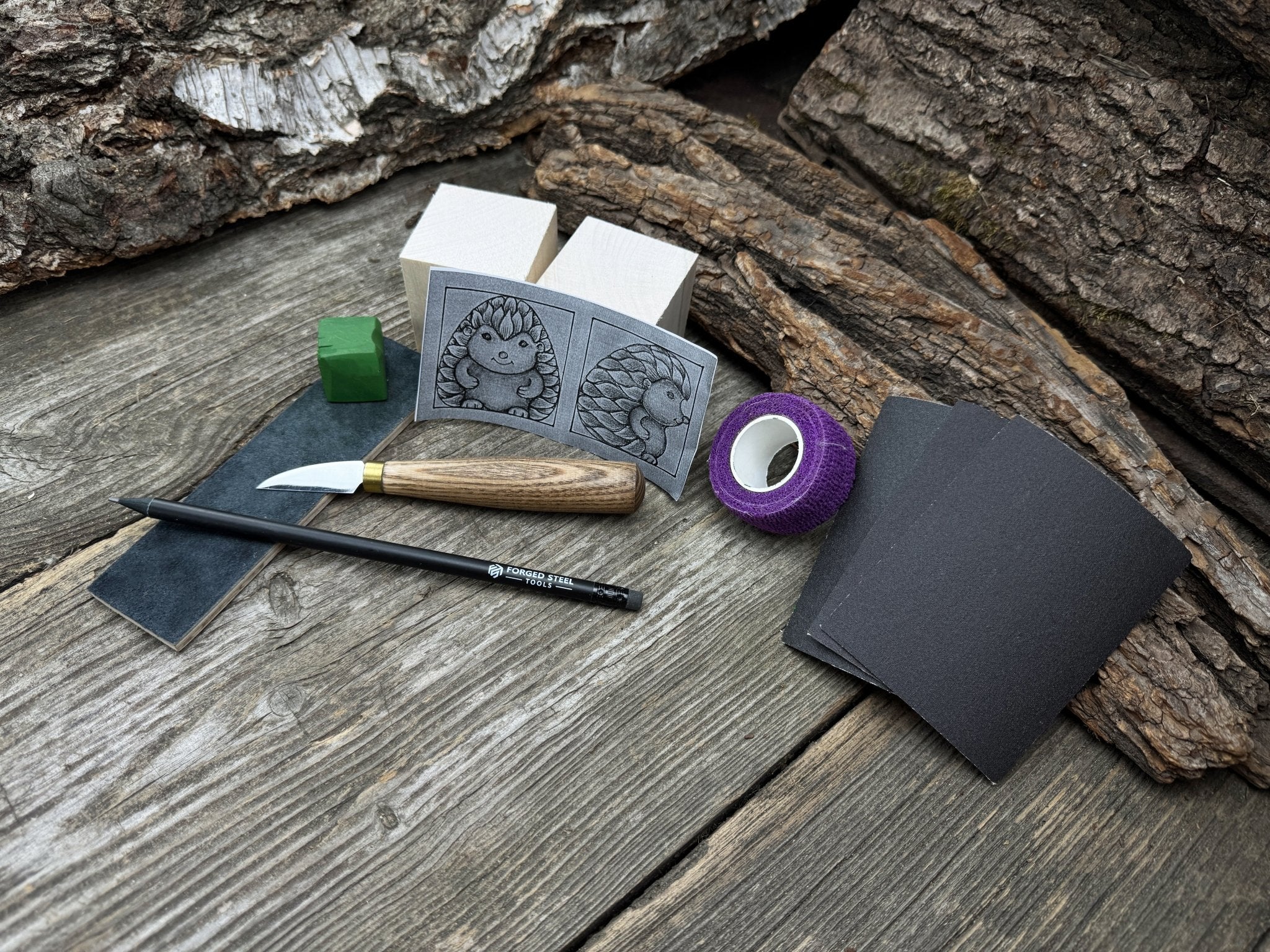 Hedgehog Wood Carving Kit with knife, wooden blocks, sandpaper, sharpening board, pencil, and hedgehog pattern