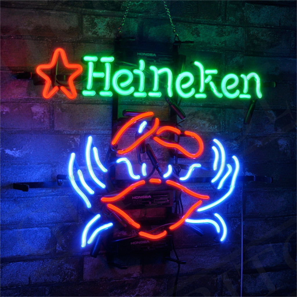 Neon sign with a red star and green 'Heineken' text above a red crab outlined with blue neon waves against a brick wall background.