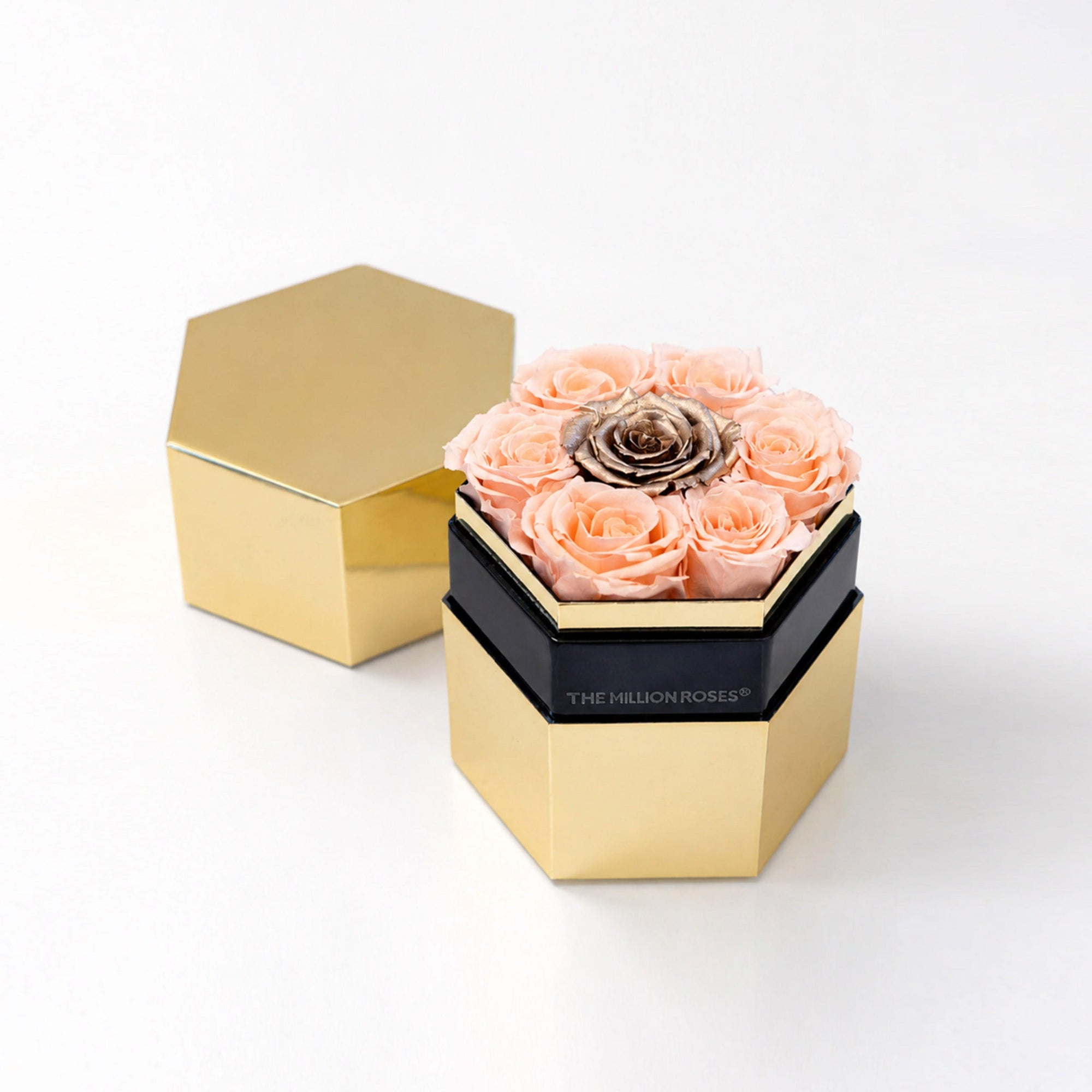 One in a Million Mirror Gold Hexagon Box showing a single large peach and gold rose inside a hexagonal gold frame.