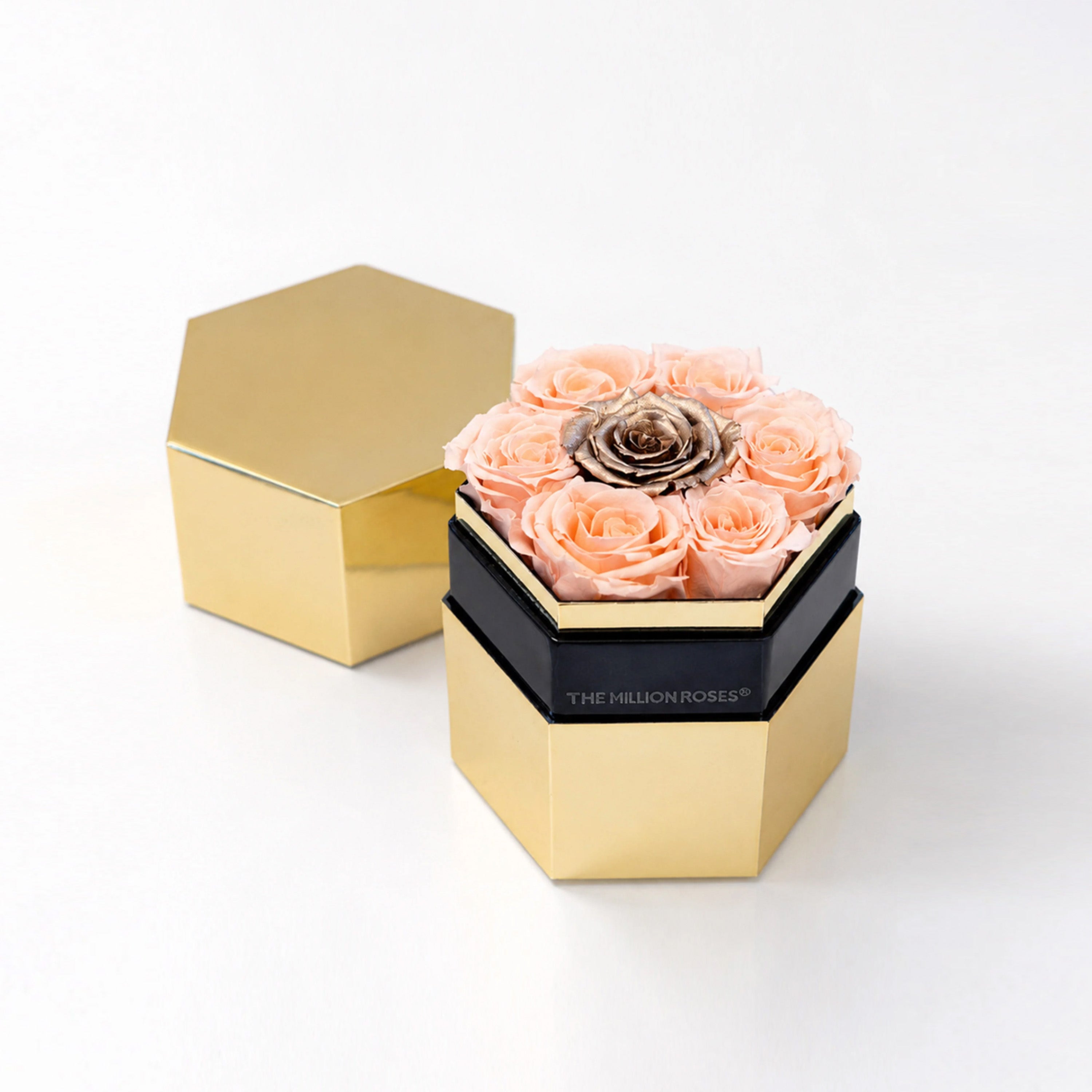 One in a Million Mirror Gold Hexagon Box showing a single large peach and gold rose inside a hexagonal gold frame.