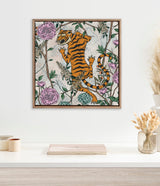 Square canvas with an orange and black striped tiger amid pink and blue flowers and green vines, framed with rounded studs on a pale background.