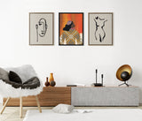 Minimalist living room with three framed artworks above a wooden and concrete console, featuring neutral line drawings of a face and body flanking a colorful patterned portrait.