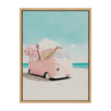 Pink vintage van parked on a sandy beach under a blue sky, with two giraffes and a bunch of pink balloons inside the van.