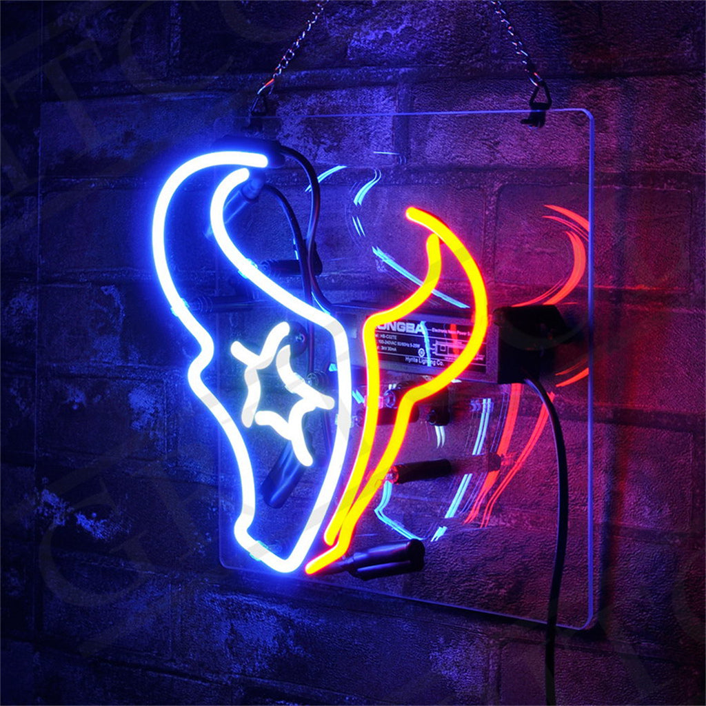 Neon sign shaped like a Houston Texans football helmet with blue, white, and red glowing outlines mounted on a dark textured wall.