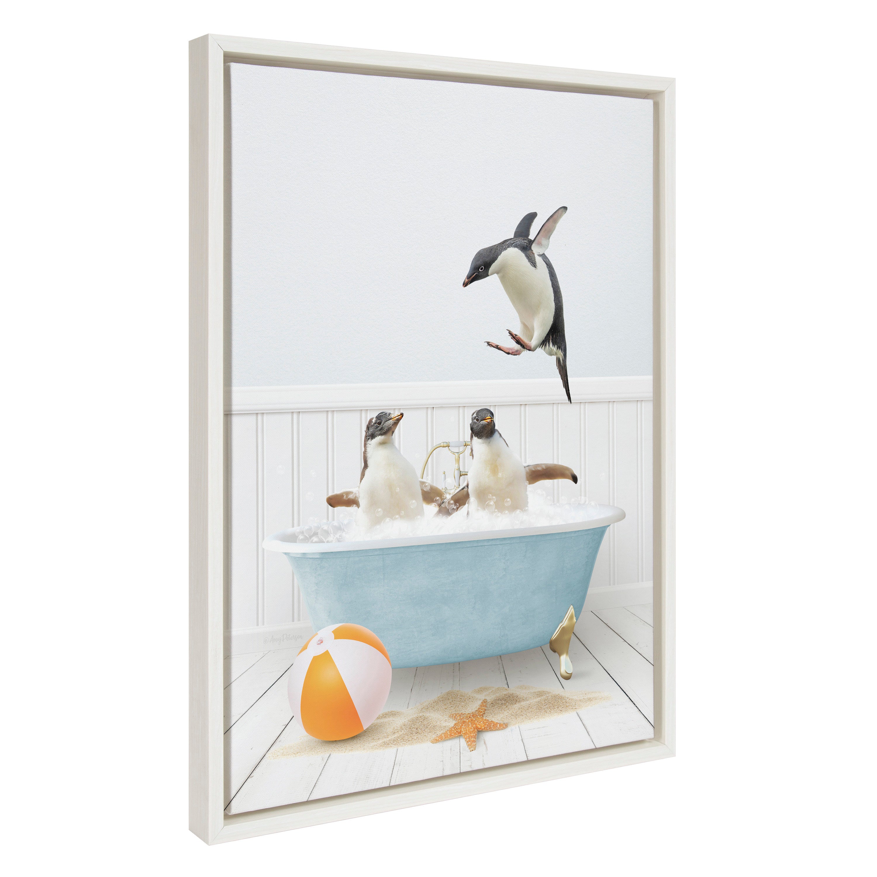 Framed canvas art featuring three penguins enjoying a bath in a beach house setting, printed and framed with a polystyrene frame.