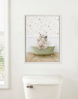 Framed canvas of a mother and baby polar bear sitting together inside a vintage light green clawfoot bathtub against floral wallpaper in a cozy country cottage bath setting.