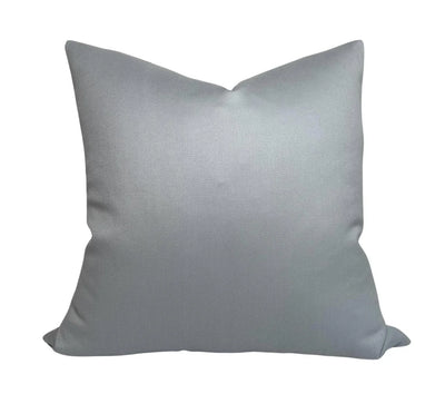 Light blue Lucida Pillow Cover showing woven wool front texture and ivory linen back