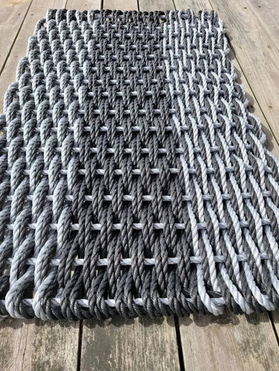 Large double weave lobster rope door mat in vibrant colors on porch