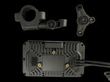 Black rectangular GPS device with heat-dissipating ridges and three gold mounting points, accompanied by two black plastic mounting brackets, on a black background.