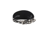 Black and white zebra print hair-on-hide leather collar with silver buckle and loop, viewed from an angle showing the buckle details.