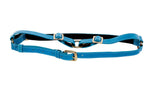Blue vegetable-tanned leather harness with adjustable straps and gold-tone buckle hardware, shown laid flat on a white background.