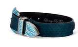 Dark teal snake-patterned pet collar with iridescent blue-green finish and bright blue Swarovski crystal-studded silver buckle and hardware.