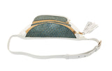 Pearl white leather fanny pack with two zippered pouches made from green textured tilapia skin, featuring gold-tone zippers and a white leather tassel on one zipper.