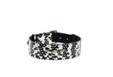 Black and white snake-patterned collar with classic gold buckle and hardware, shown from a slight side angle on a white background.