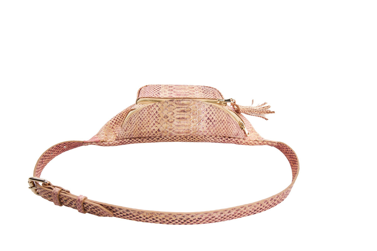Light pink embossed snake pattern belt bag with gold-tone zipper and matching adjustable strap, photographed from a front low angle on white background.