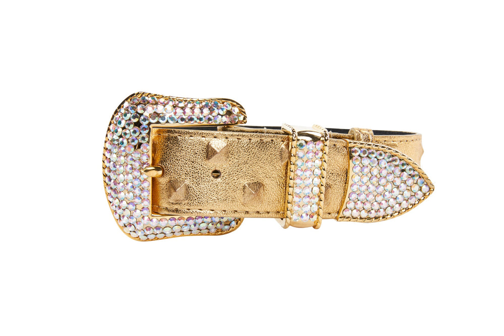 Gold leather belt buckle and strap tip adorned with iridescent Swarovski crystals, featuring gold studs on the strap area.