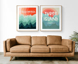 Two framed modern art prints above a tan leather sofa, featuring layered wave patterns in warm reds and cool blues with text 'Folly Beach South Carolina' and 'Tybee Island Georgia'.