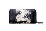 Rectangular zip wallet with black and white python skin pattern and a black zip pull tab, shown front-facing on a white background.