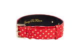 Red Italian leather dog collar with gold polka dots and a gold buckle, featuring 'Luxury Pet Fashion' embossed inside in gold lettering.
