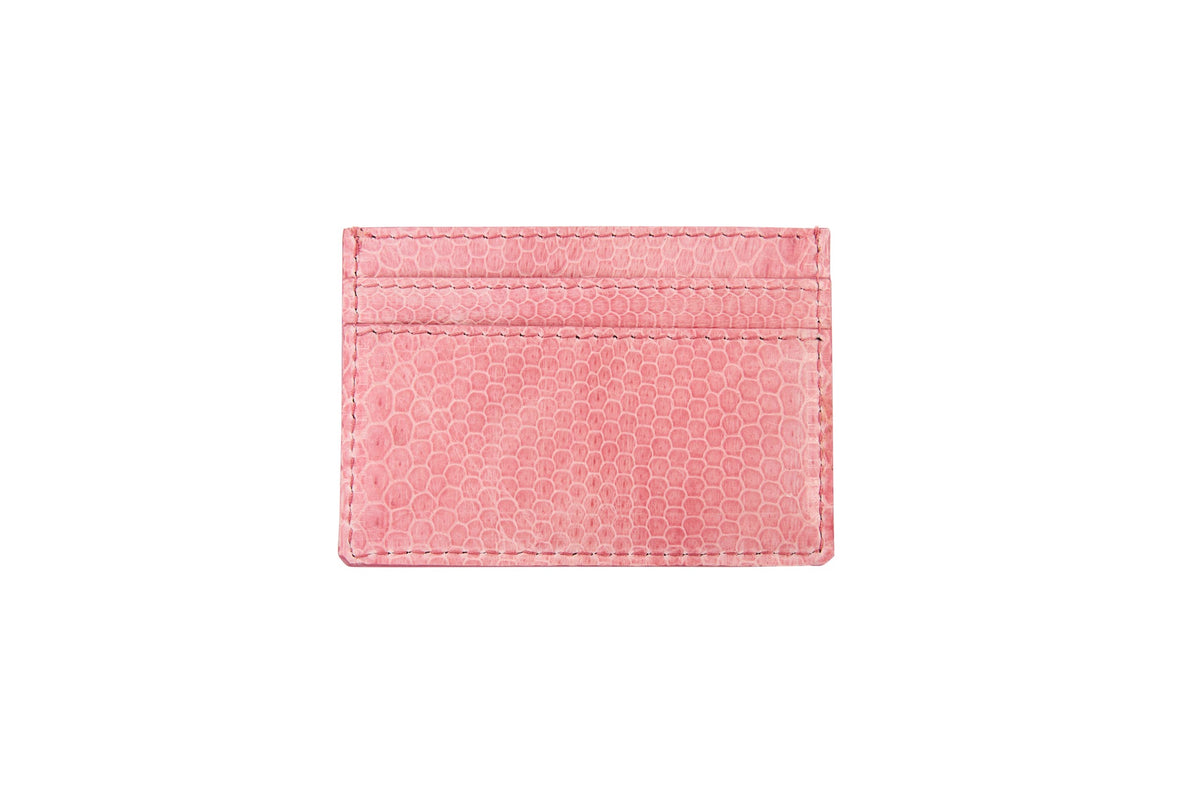 Soft pink card wallet with a subtle snake skin texture and two card slots visible on one side against a white background.