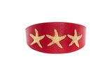 Red Italian leather collar approximately 3 inches wide featuring three custom gold starfish embellishments evenly spaced across the center.