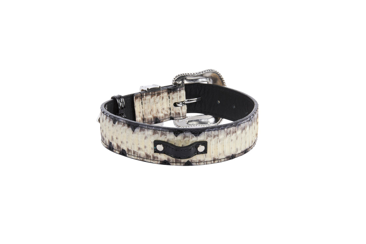 Off-white, grey, and black snake-patterned leather belt with silver Swarovski crystal-embellished buckle, shown coiled on a white background.