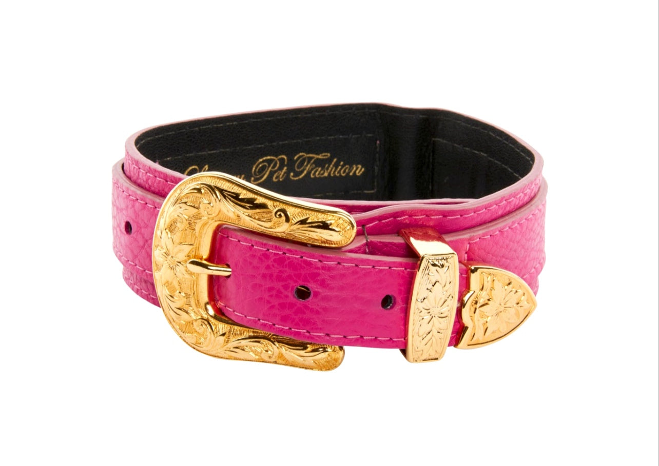 Pet collar in soft fuchsia Italian leather with custom gold western floral hardware on a neutral background