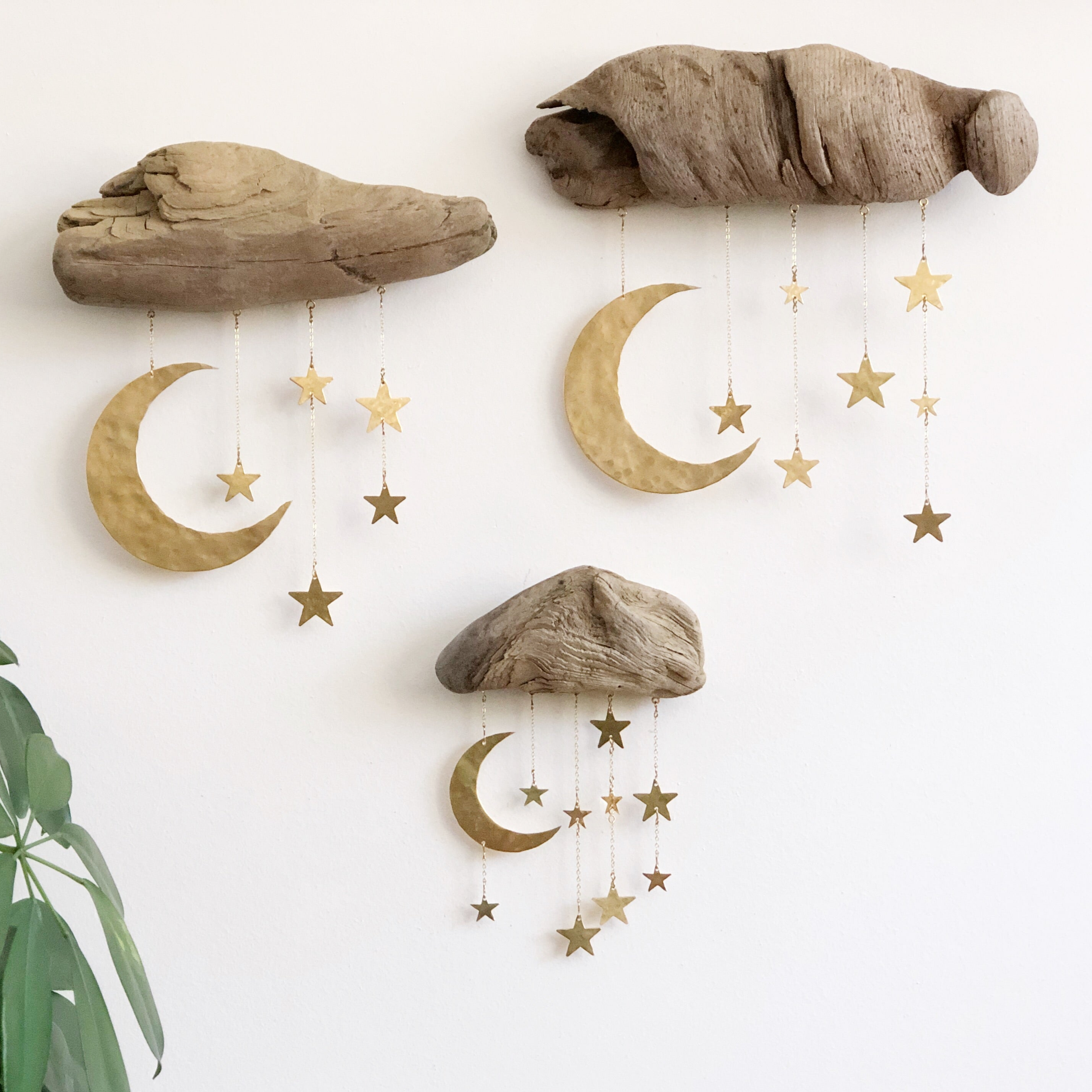 Goodnight Moon Wall Sculpture featuring driftwood and hammered brass hanging on a white wall
