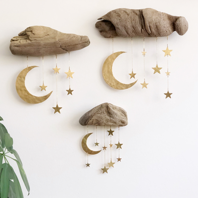 Goodnight Moon Wall Sculpture featuring driftwood and hammered brass hanging on a white wall
