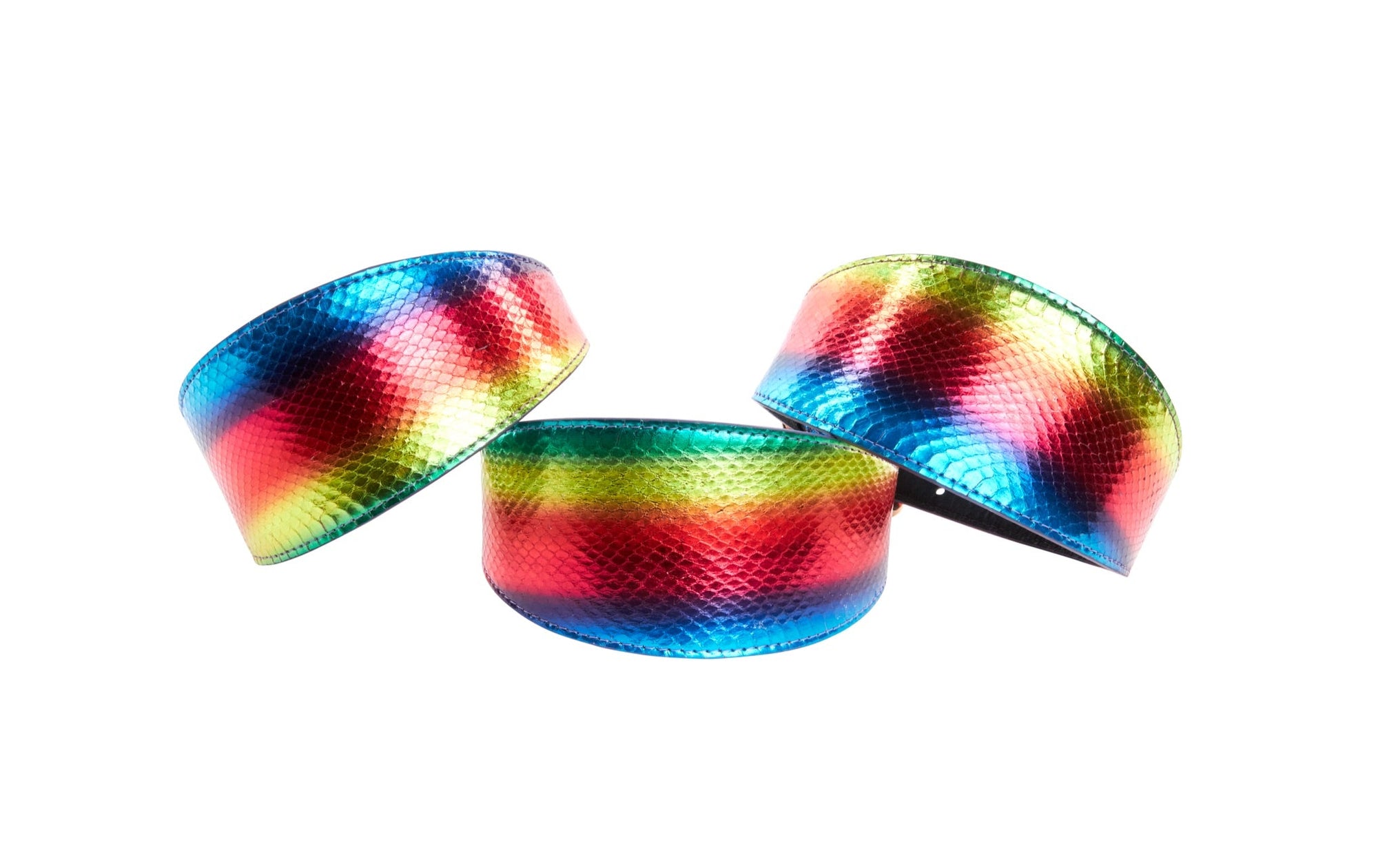 Three wide pet collars with rainbow snake pattern displayed side by side