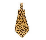 Small wide leather tie with leopard print pattern in black on a tan background, featuring a loop at the top for hanging or attachment.