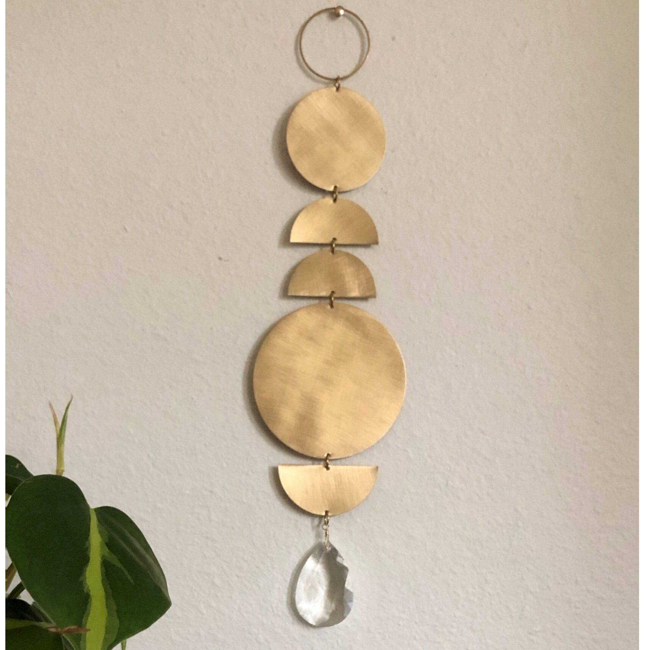 When the Sun Comes Suncatcher showing hammered brass and vintage faceted crystal details.