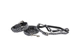Black and gray patterned dog leash and collar set with geometric diamond designs, featuring metal clasps and adjustable buckle hardware, displayed on white background.