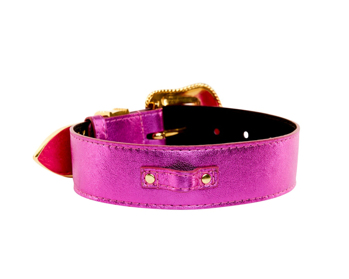 Bright pink metallic leather collar with gold-tone buckle and hardware, set against a white background in a close-up side view.