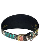 Wide leather collar with multicolor embossed snake pattern featuring turquoise, pink, black, and yellow scales, and a gold-toned buckle and D-ring.