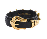 Black Italian leather collar with large gold starfish-shaped buckle and gold loop detail, embossed with cursive gold lettering inside.