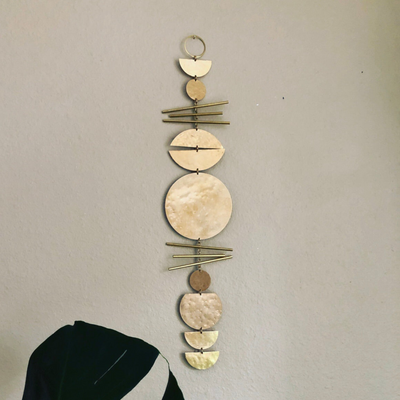 Sun Salutations wall hanging showing hammered brass and driftwood detail