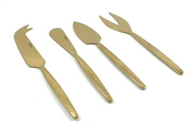 Golden Cheese knives set of 4 with hammered stainless steel handles arranged on a light surface