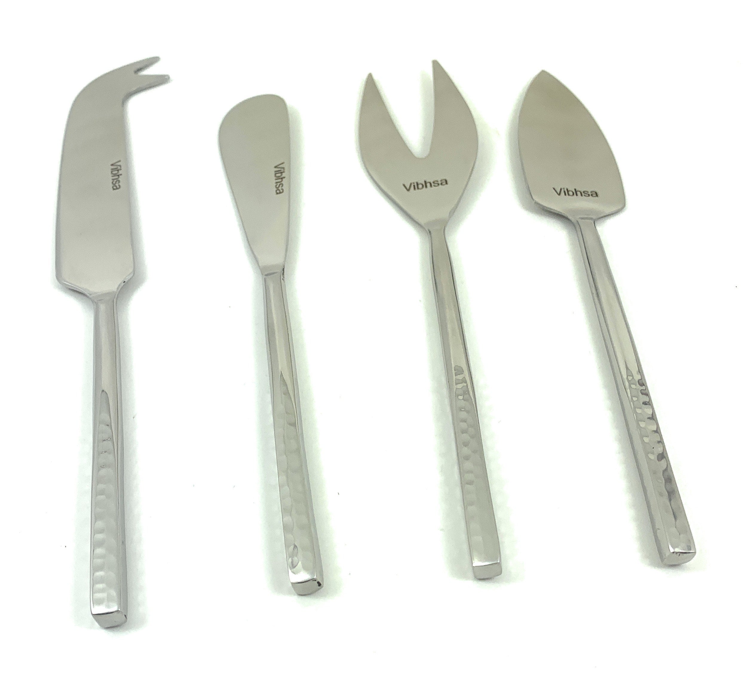 Silver Cheese knives set of 4 Stainless Steel Silver displayed on a dark wood surface