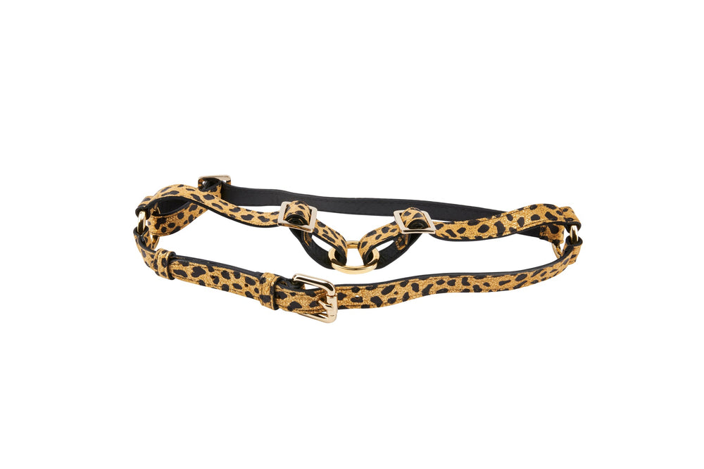 Adjustable harness with leopard print Italian leather straps and gold-tone metal buckles on a white background.