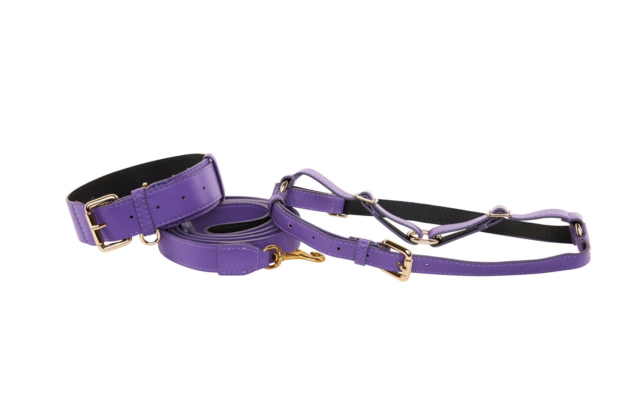 Purple Italian leather collar, leash, and harness set for pets displayed on light background