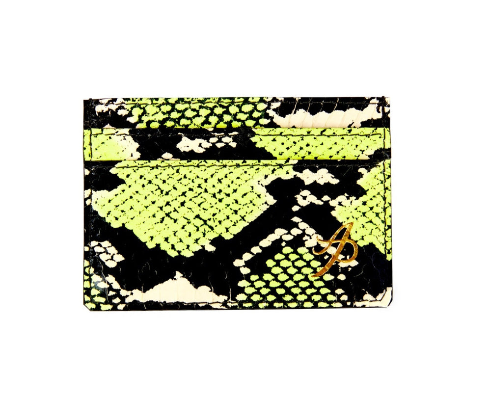 Rectangular card wallet with neon green, black, and white snake pattern and a small gold monogram detail in the bottom right corner.