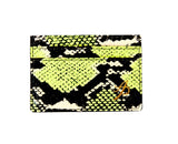 Rectangular card wallet with neon green, black, and white snake pattern and a small gold monogram detail in the bottom right corner.