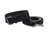 Black snake print leather belt with a gunmetal grey buckle and matching leash clip, coiled and displayed on a white background.