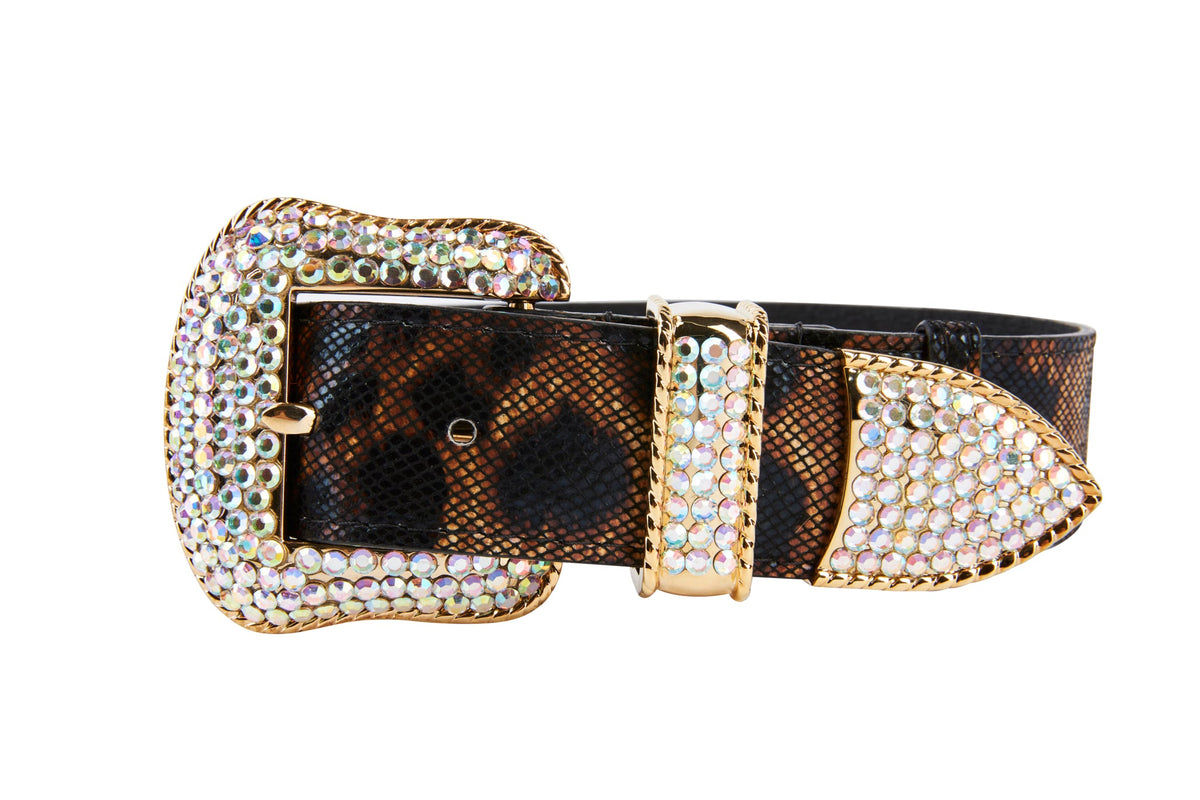 Close-up of a belt with abstract leopard print Italian leather and gold-tone hardware encrusted with clear Swarovski crystals.